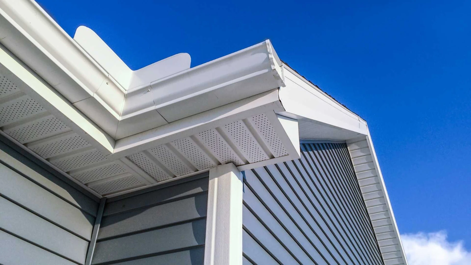 Close-up image of freshly installed blue siding.
